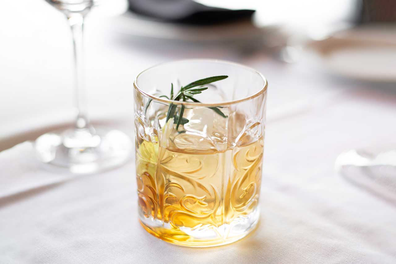 tumbler with whisky on rocks